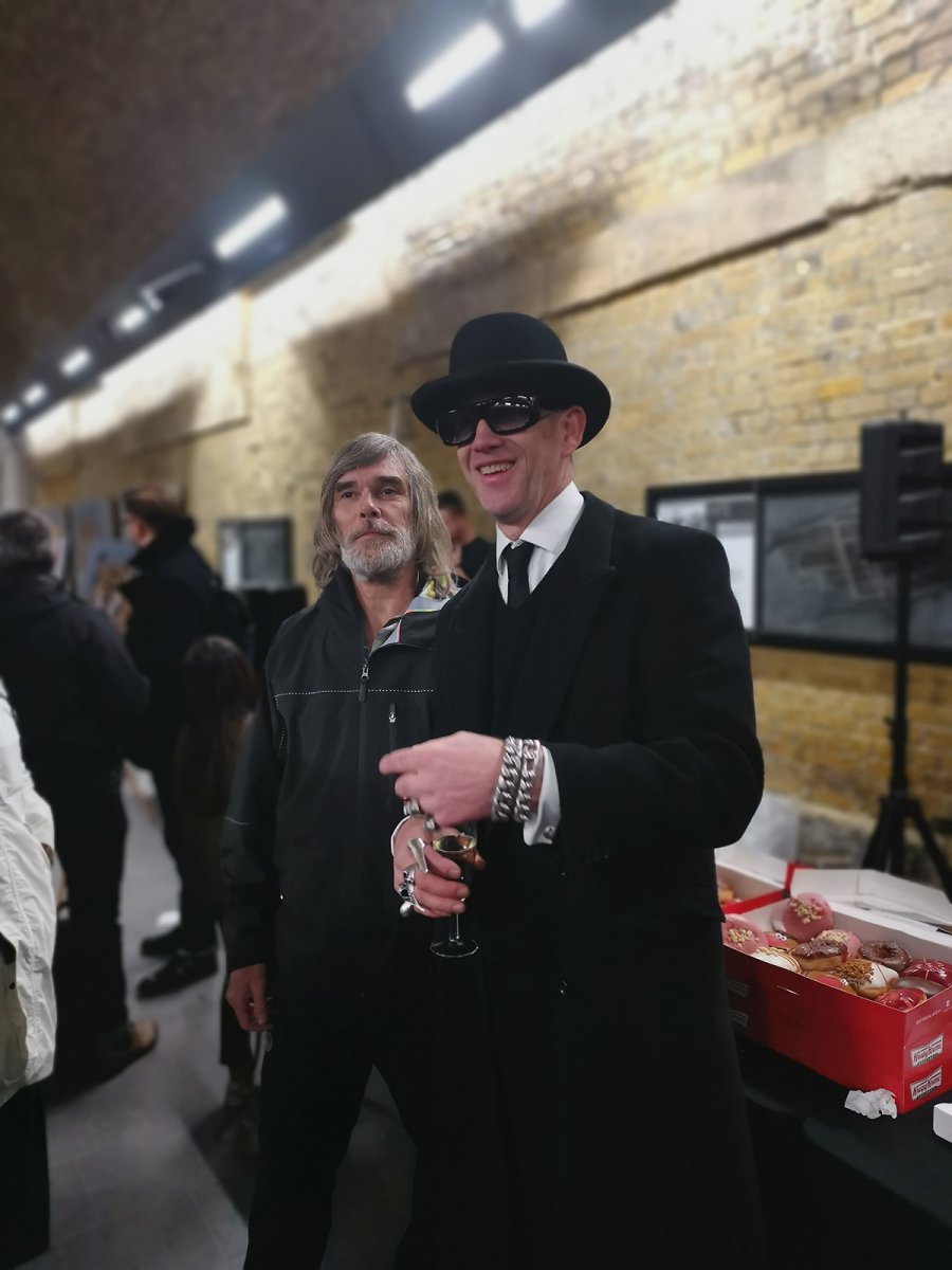 legend Ian brown and some punk in a hat