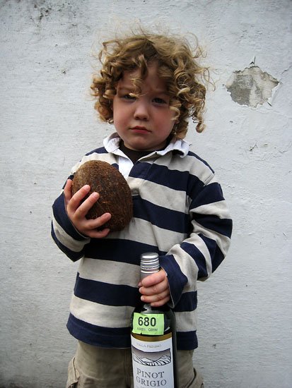 z, a coconut and a bottle of pinot grigio